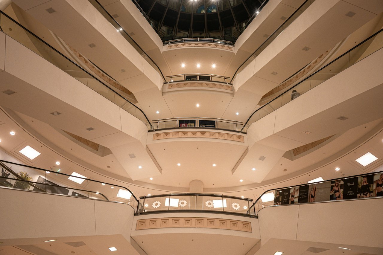 The curved balconies of a multi-level mall atrium